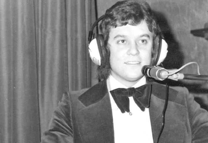 Photo of Terence on the DJ decks in black and white